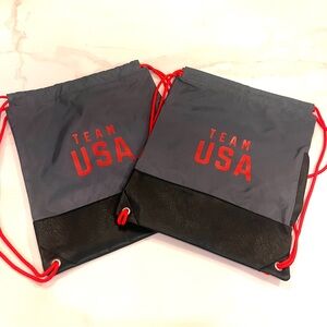 Two Team USA Drawstring Backpacks w/leather-like base (brand new)